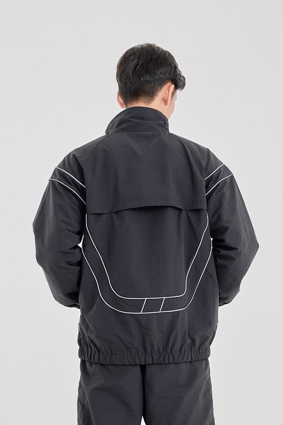 Reflective woven track jacket