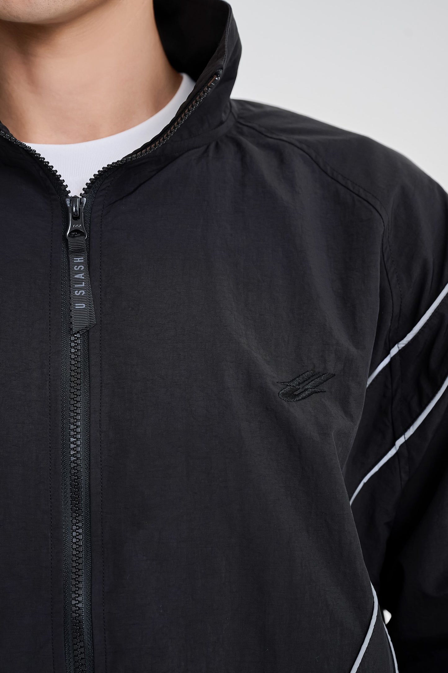 Reflective woven track jacket