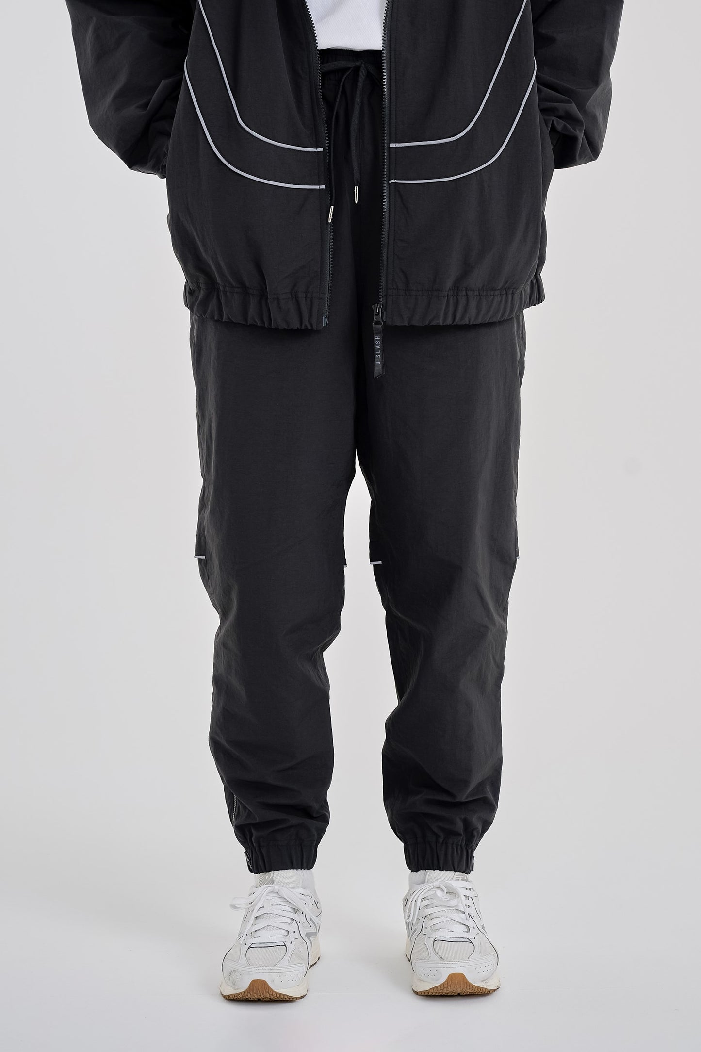 Reflective woven track pants