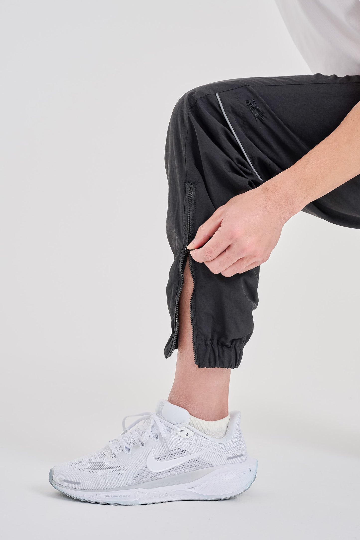 Reflective woven track pants