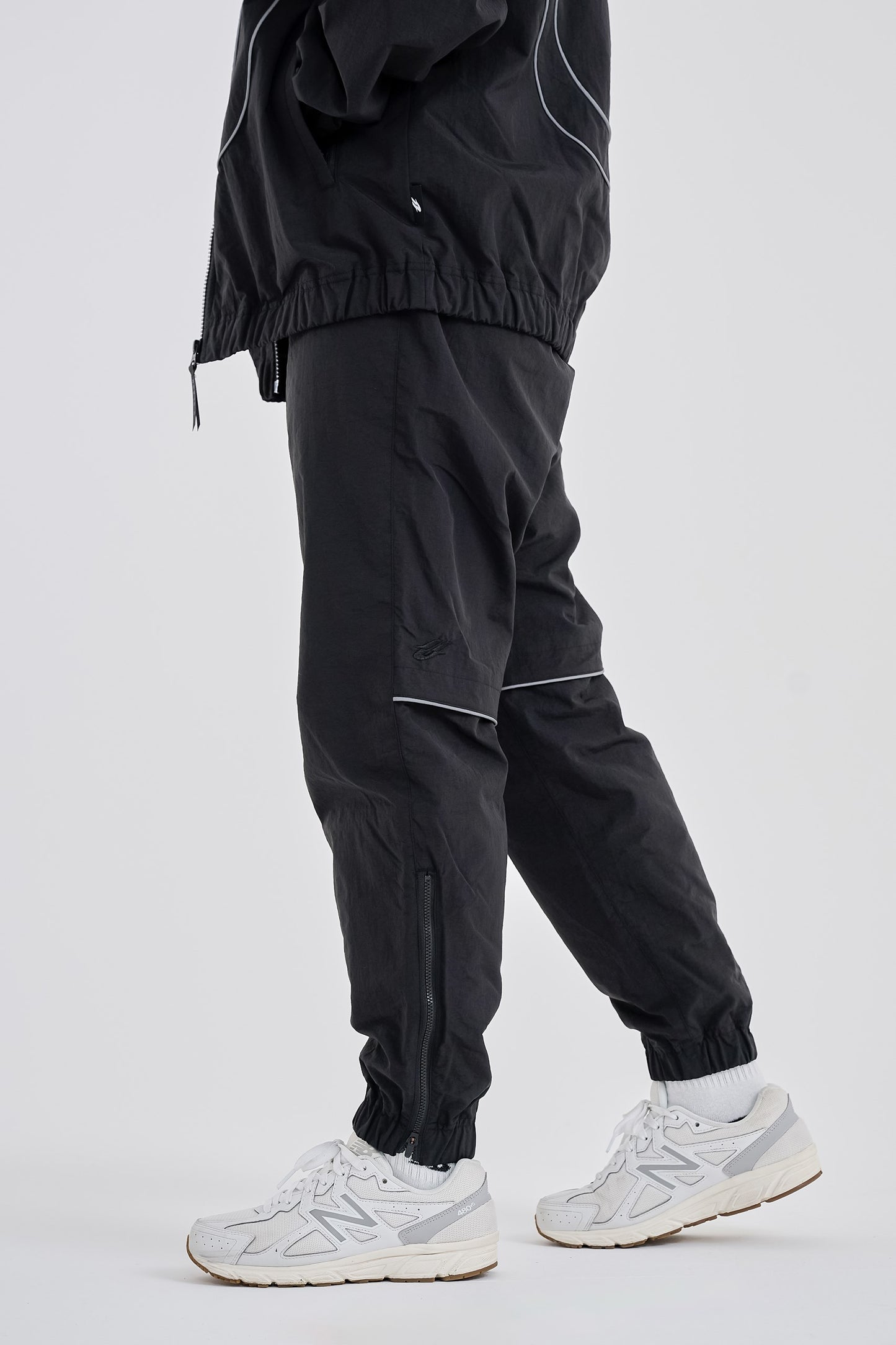 Reflective woven track pants
